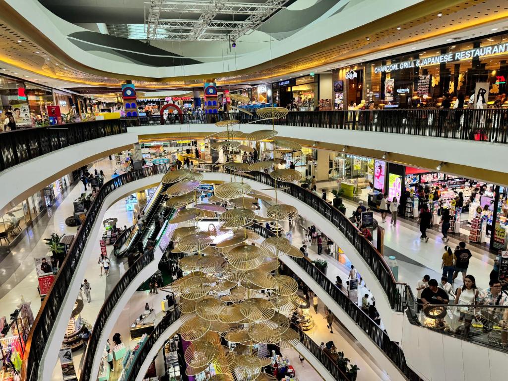 an overhead view of a shopping mall with a crowd of people at Condo is next to the mall Big swimming pool 2 in Chiang Mai