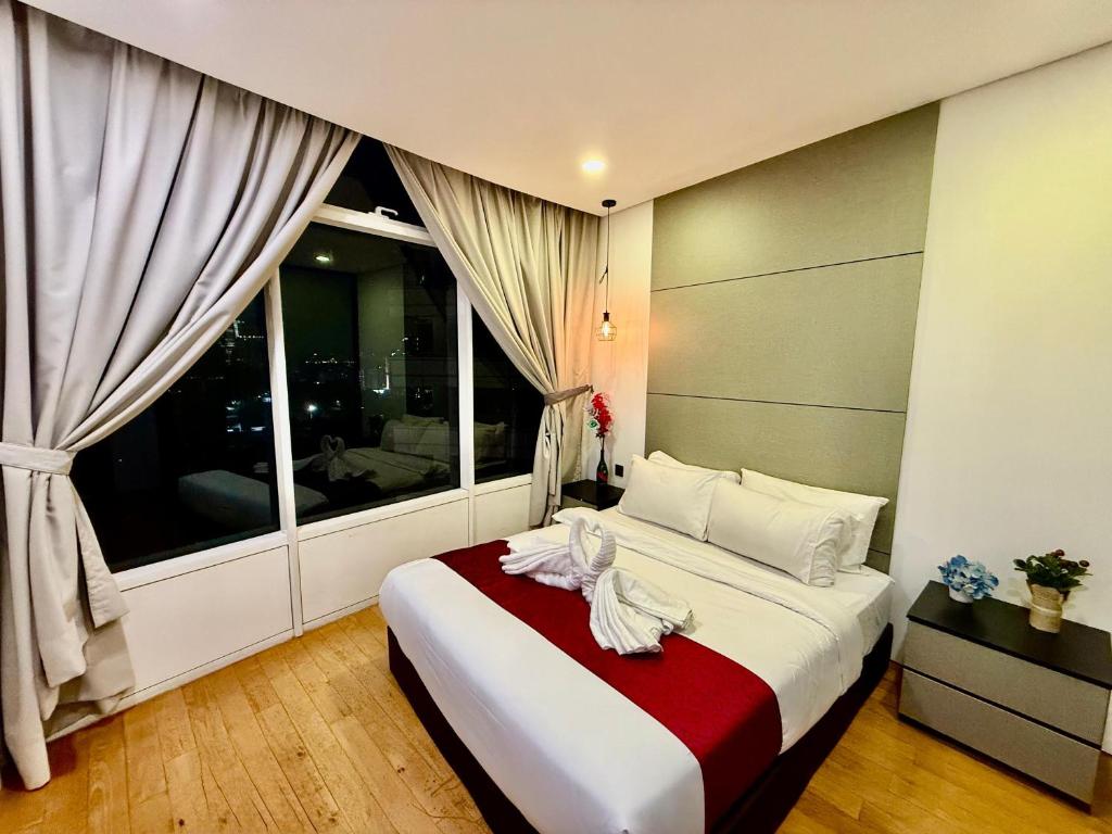 Postel nebo postele na pokoji v ubytování Vortex Hotel Suites & Residence by KLCC