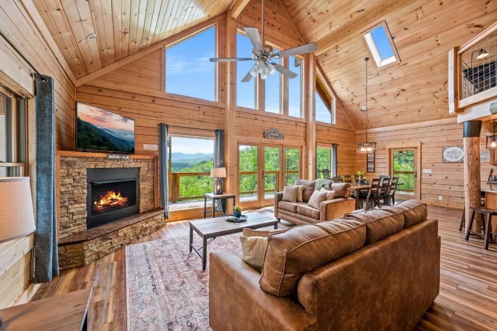 a living room with a couch and a fireplace at Rustic Retreat By Avada Properties in Greystone Heights