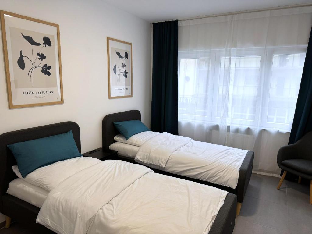 Un pat sau paturi într-o cameră la ProStays Apartment in Mönchengladbach - 1 Schlafzimmer - 2 Betten