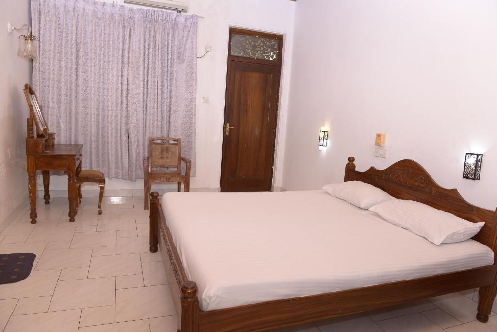 Ένα ή περισσότερα κρεβάτια σε δωμάτιο στο Pala House