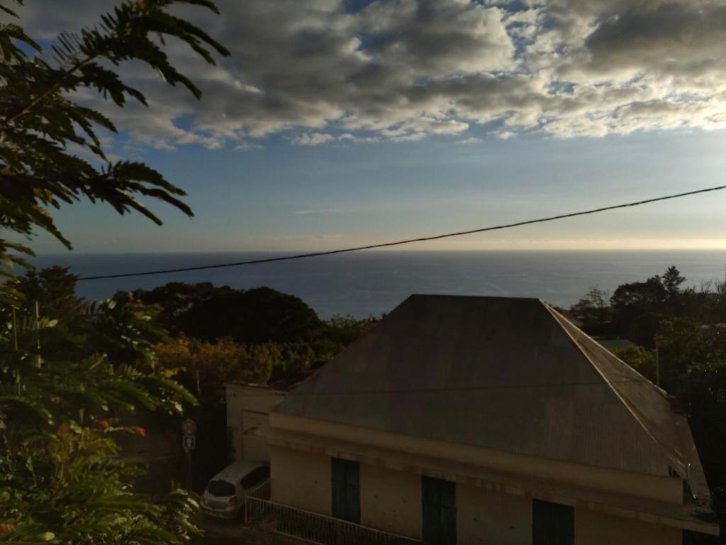 a view of the ocean from the roof of a building at Studio Les Avirons centre ville in Les Avirons