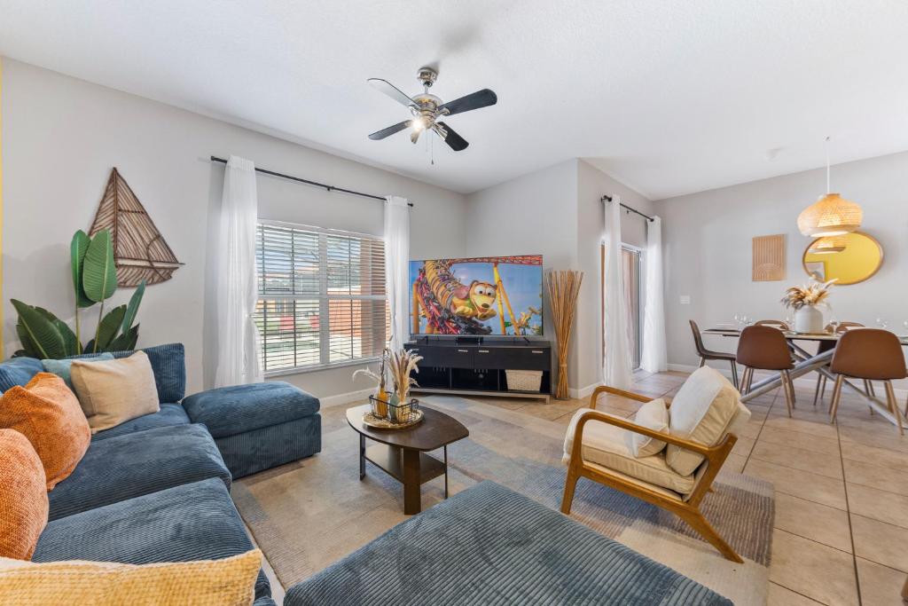 a living room with a couch and a table at 8847 Candy Palm Rd in Kissimmee