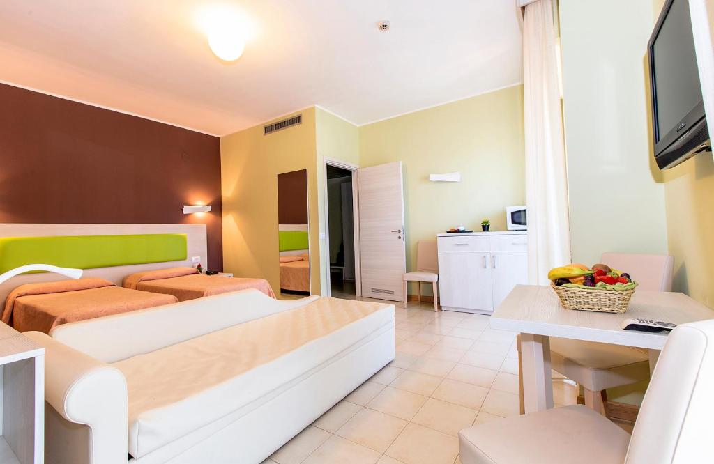 A bed or beds in a room at Hotel Residence Ulivi E Palme