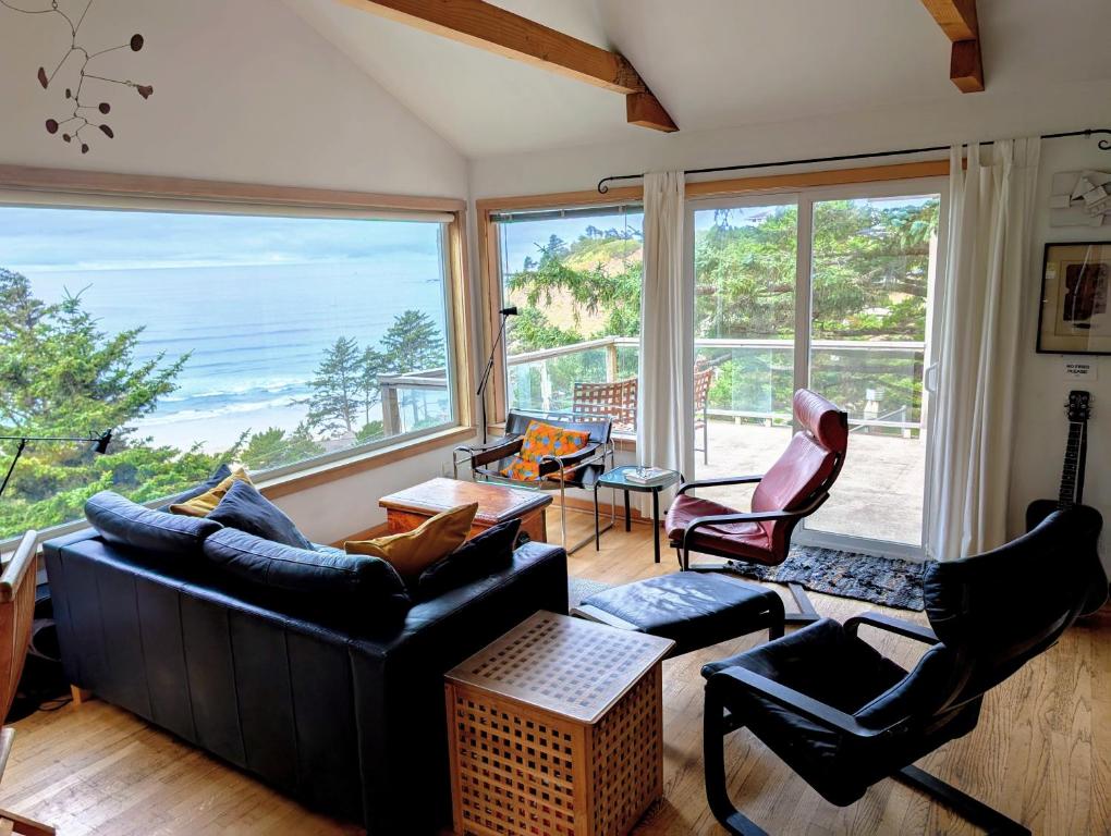 a living room with a view of the ocean at The Blue Door in Oceanside
