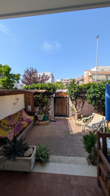 a patio with a fence and a wooden gate at Sunset House in Santa Marinella