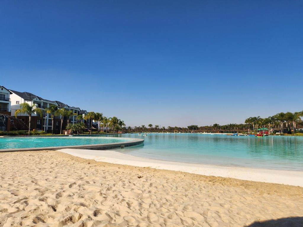 a view of a beach with a body of water at 1 Bed Crystal Lagoon Escape in Pretoria