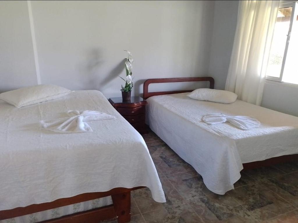 Postel nebo postele na pokoji v ubytování Villa Rosita