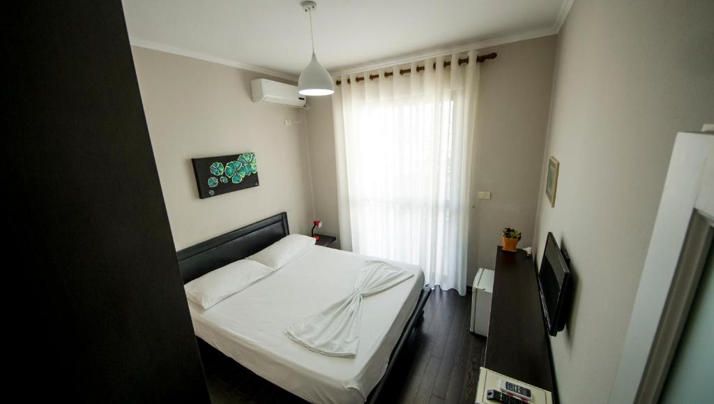 Postel nebo postele na pokoji v ubytování Kadrisa Hotel