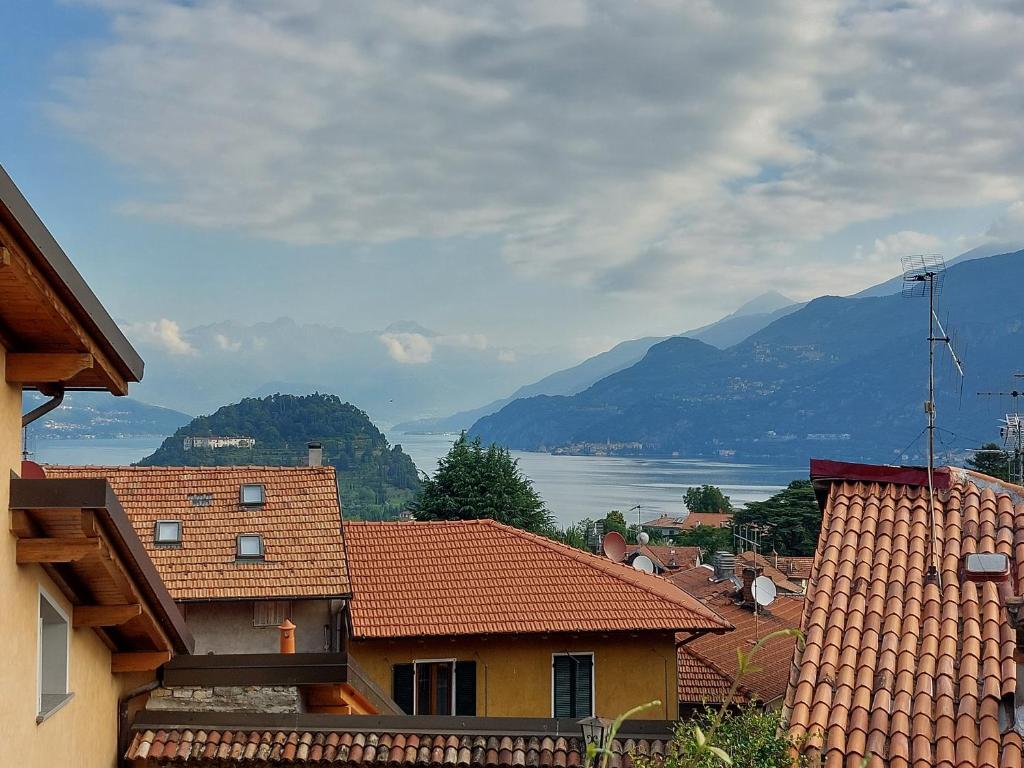 a view of a town with mountains and a lake at Antica Filanda, comfort & charm in Bellagio