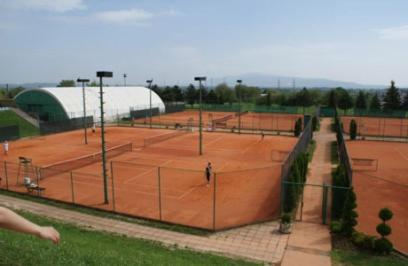 a group of tennis courts in a park at Apartments Maja in Split