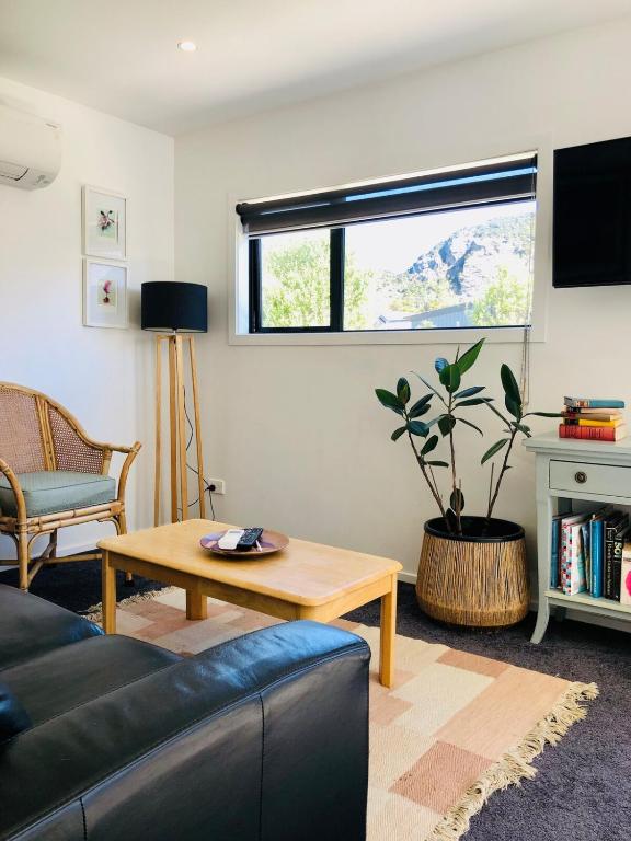 a living room with a couch and a table at The Perch in Albert Town