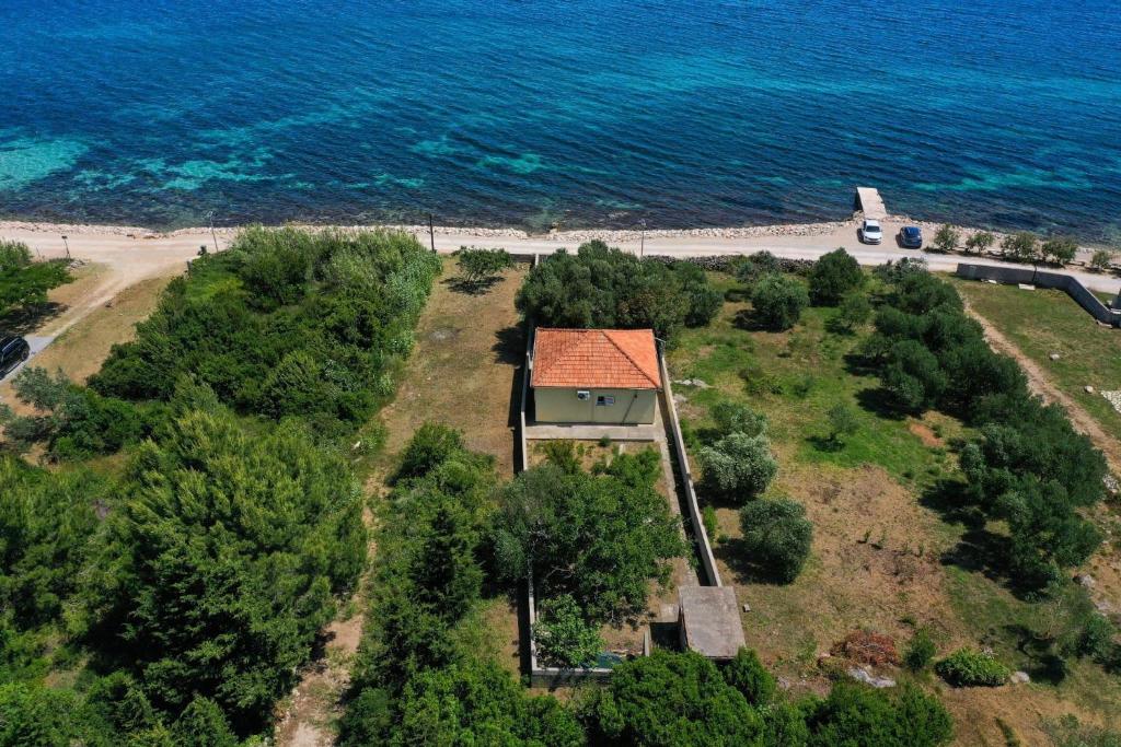 an aerial view of an island with a house at Seaside house for families with children Banj, Pasman - 24665 in Kukljica