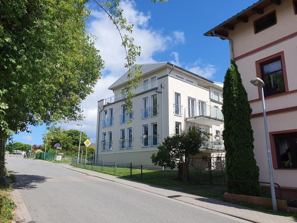a white building on the side of a street at Holiday apartment with 2 bedrooms in Sassnitz