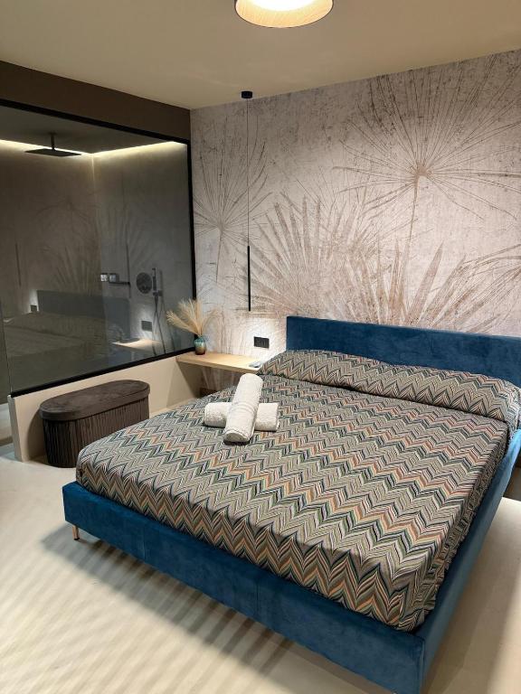 Ένα ή περισσότερα κρεβάτια σε δωμάτιο στο Vaniedda Suite