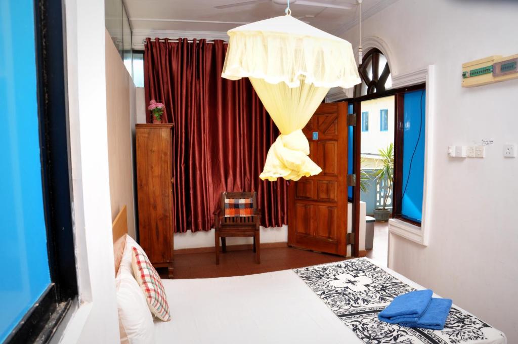Postel nebo postele na pokoji v ubytování Blumarine Guest House