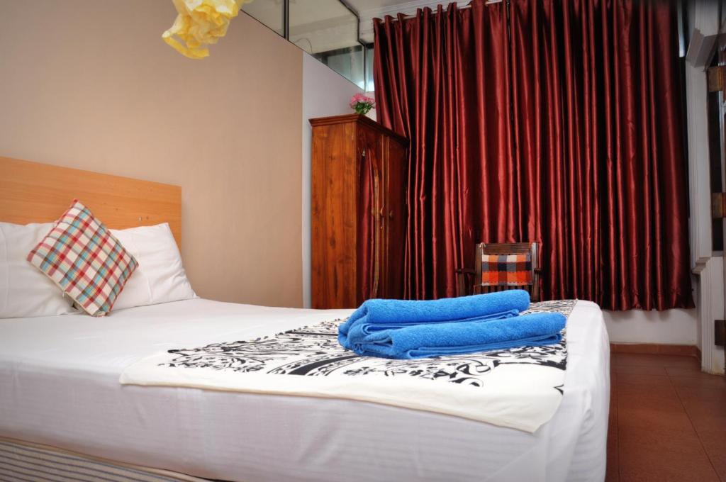 Postel nebo postele na pokoji v ubytování Blumarine Guest House