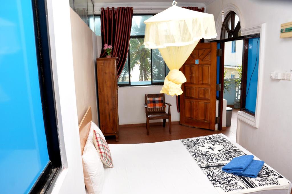 Postel nebo postele na pokoji v ubytování Blumarine Guest House