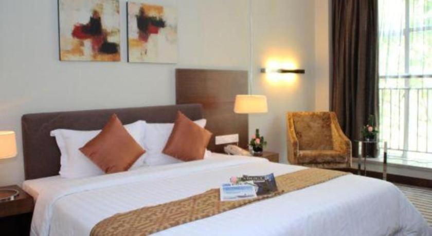 Postel nebo postele na pokoji v ubytování Poly Hotel