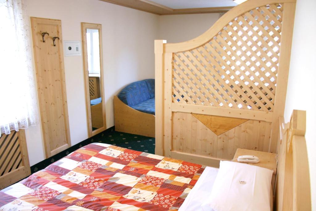 Postel nebo postele na pokoji v ubytování Hotel Cima Dodici
