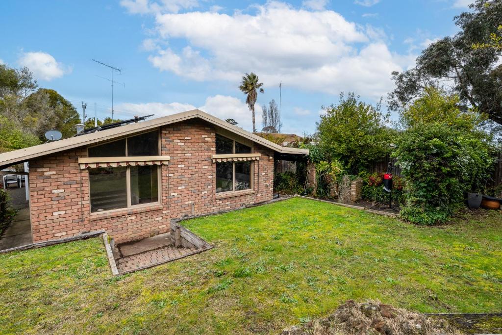 a brick house with a lawn in front of it at Spacious, Pet Friendly, Near Boat Ramp and Water in Clifton Springs