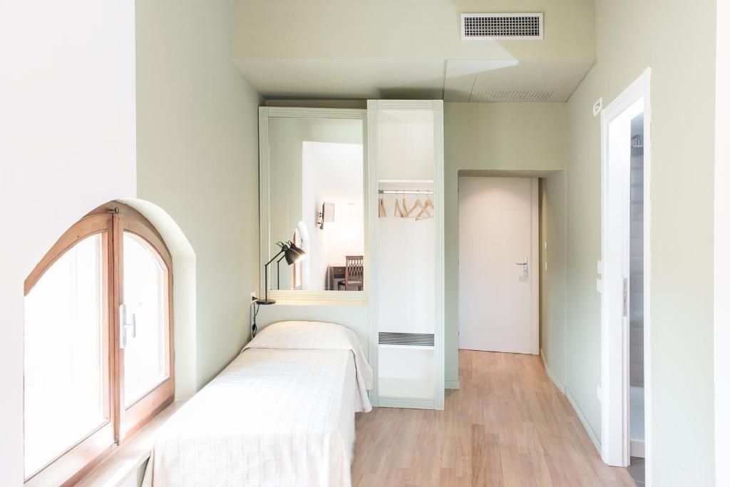 Postel nebo postele na pokoji v ubytování Albergo Il Rientro
