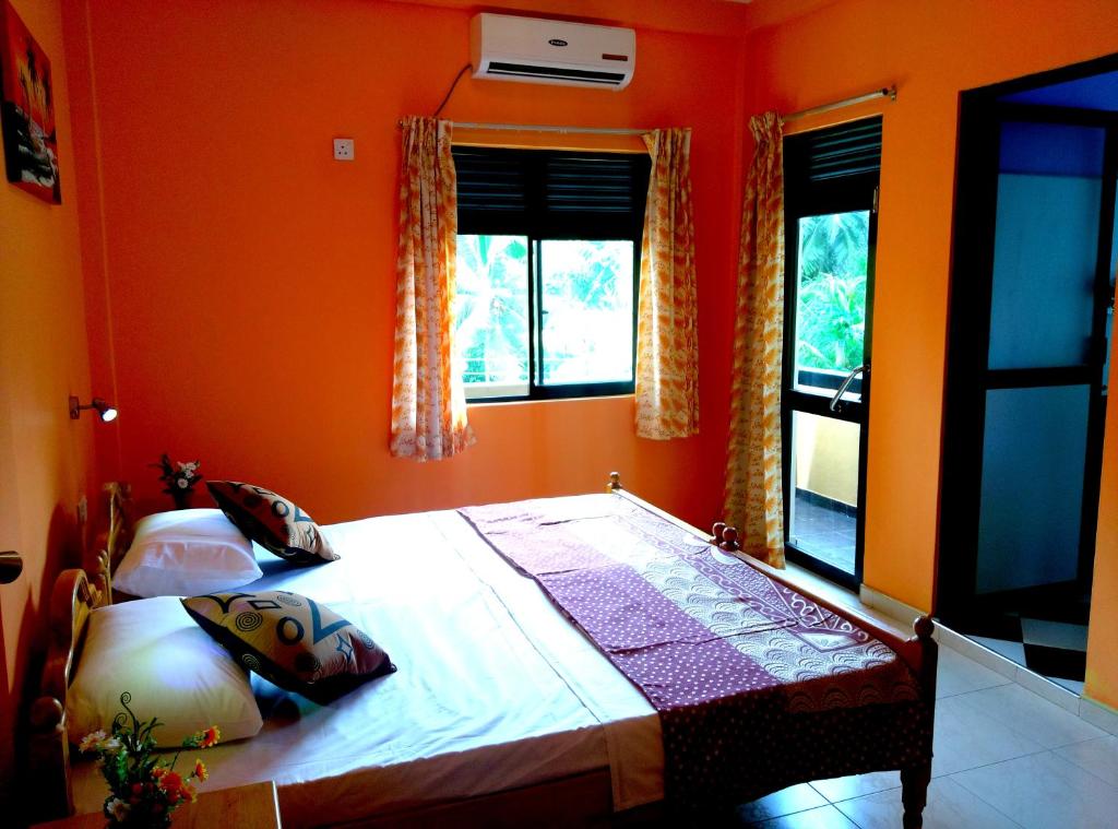 Postel nebo postele na pokoji v ubytování Basilico Homestay