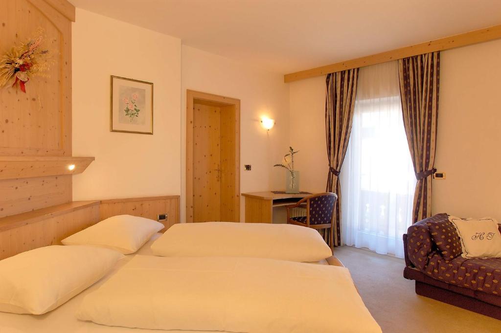Postel nebo postele na pokoji v ubytování Hotel Teresa