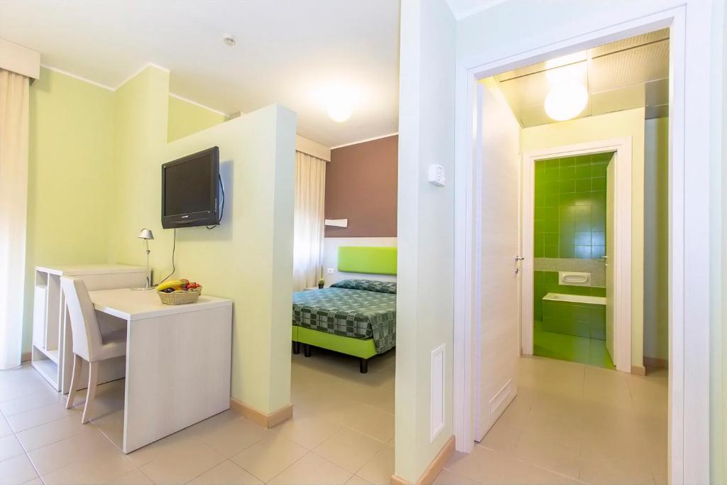 A bed or beds in a room at Hotel Residence Ulivi E Palme