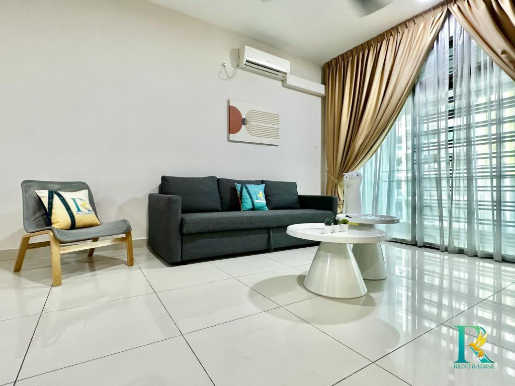 a living room with a couch and a table at Parc Regency by RR JBcity in Johor Bahru
