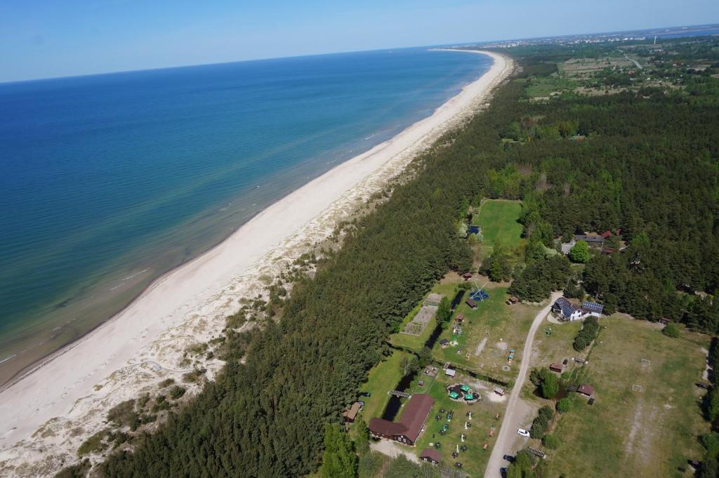 an aerial view of a beach and the ocean at Vērbeļnieki in Pērkone