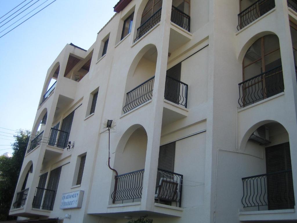 an apartment building with balconies on the side at Chariandry Court in Pissouri