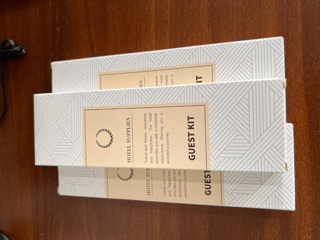 three boxes sitting on top of a wooden table at Lubrin Townhouse in San Pablo