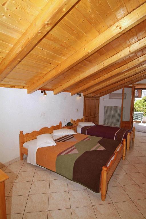 Postel nebo postele na pokoji v ubytování Hotel Orfeas