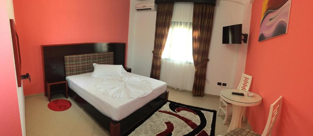 Postel nebo postele na pokoji v ubytování Hotel Siklad