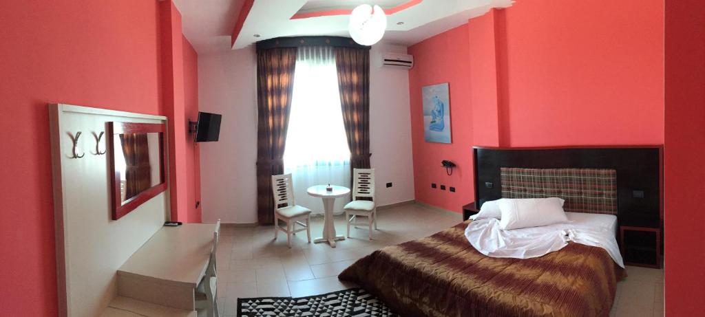 Postel nebo postele na pokoji v ubytování Hotel Siklad