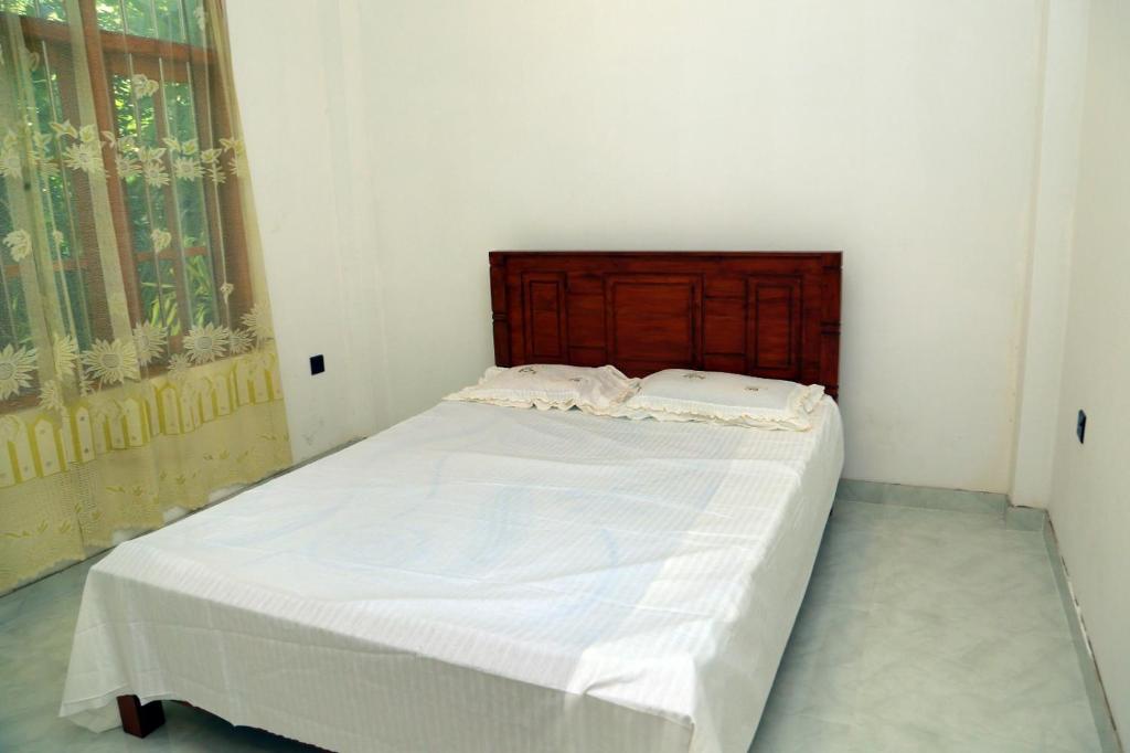 Ένα ή περισσότερα κρεβάτια σε δωμάτιο στο Villa Nature's Bounty