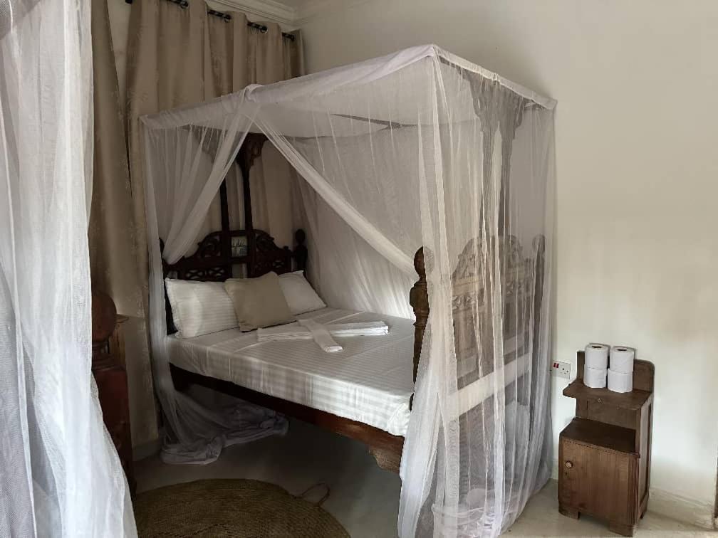 Ένα ή περισσότερα κρεβάτια σε δωμάτιο στο Zenu House