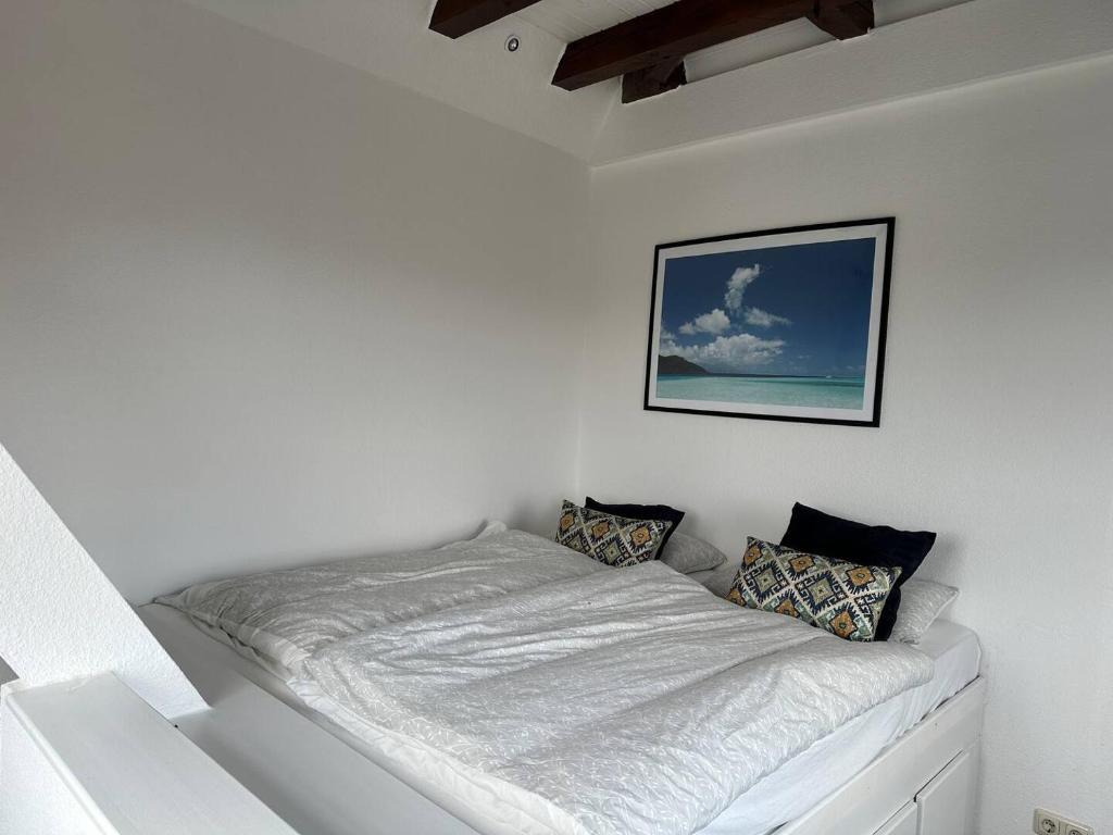 Postel nebo postele na pokoji v ubytování Wohnen im alten Feuerwehrturm