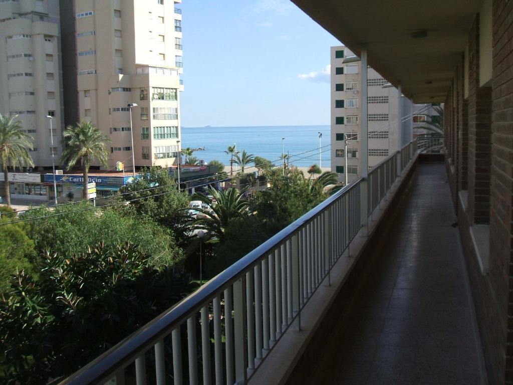 a balcony of a building with a view of the ocean at Apartamentos Congo in El Campello