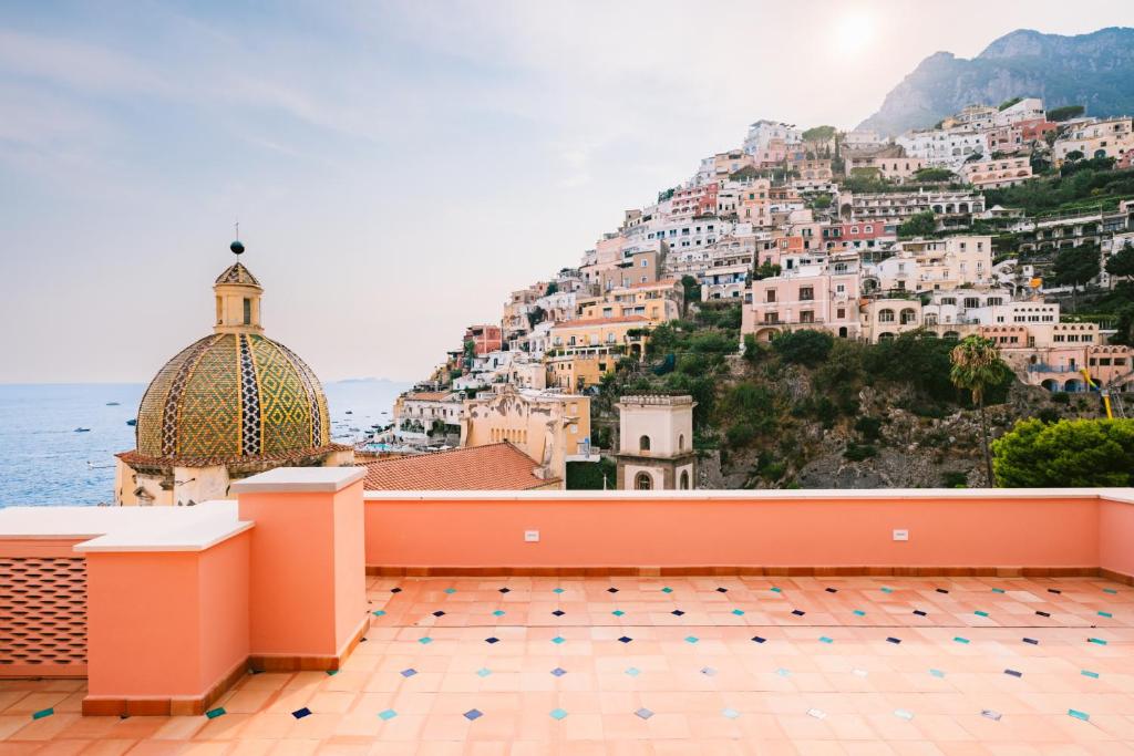 a view of positano from a terrace of a building at Dimora Donna Teresa in Positano