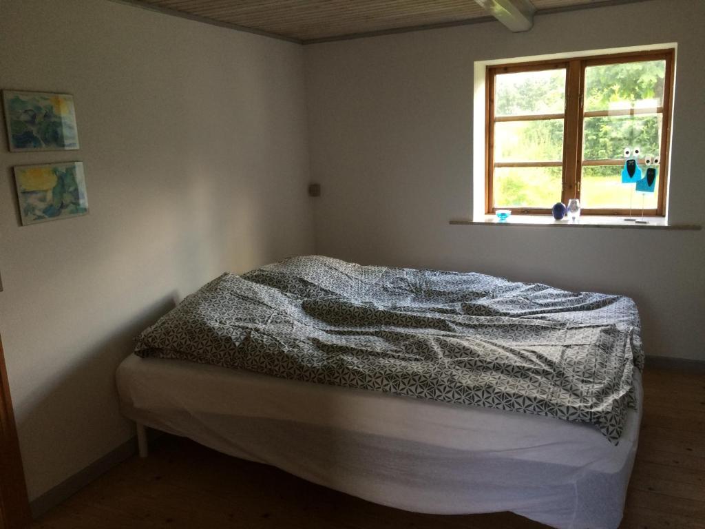 Postel nebo postele na pokoji v ubytování Øster Mogensbæk #4