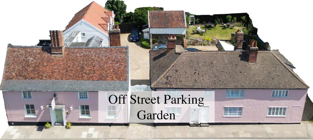 a house with a sign that reads off street parking garden at The Abbey Hotel & Apartments in Bury Saint Edmunds