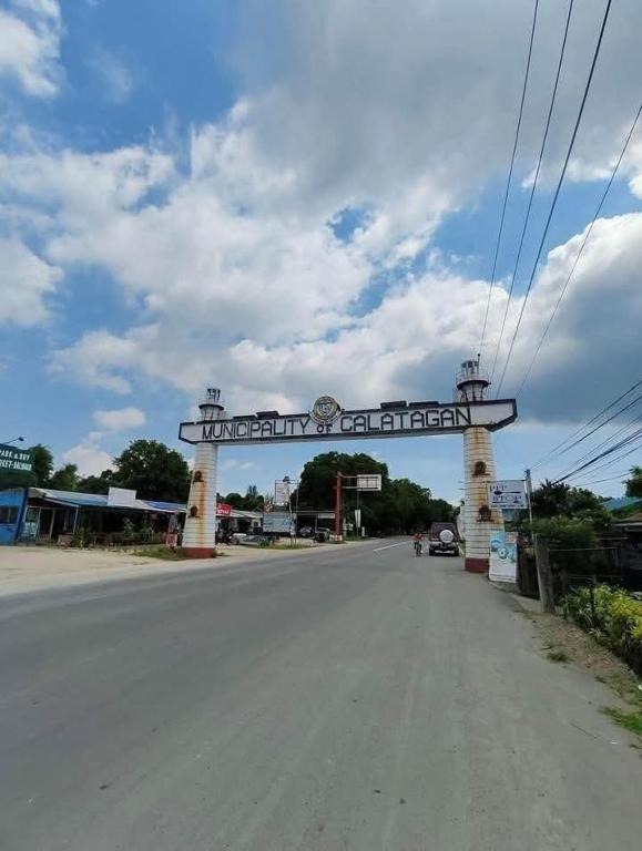 a sign for a gas station on the side of a road at Baylosis Resort in Calatagan