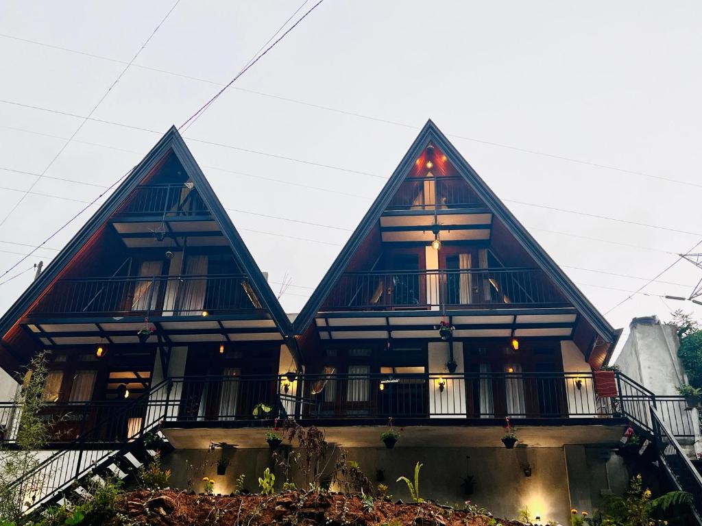 a house with two pointed roofs at Sithgiri Drem line cottage in Nuwara Eliya