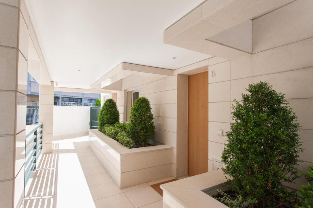 an internal view of a building with plants at Living Graça in Lisbon