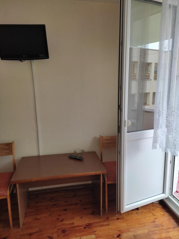 Televisor o centre d'entreteniment de Apartamentai Šilingės