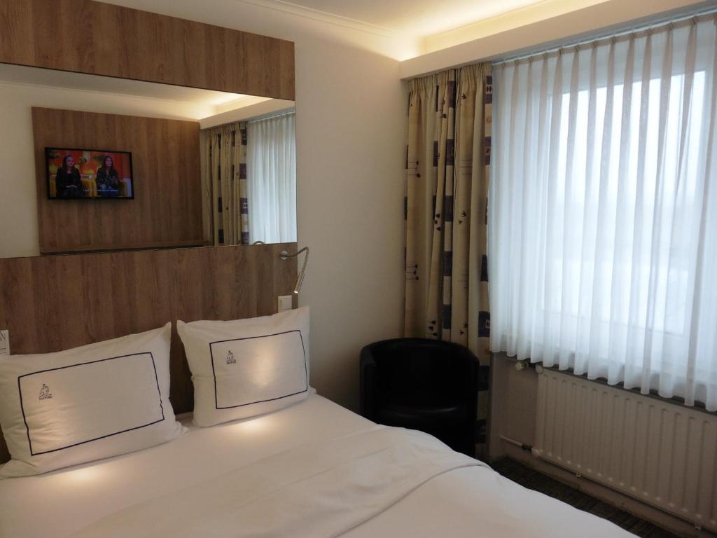 Rúm í herbergi á Hotel Empire