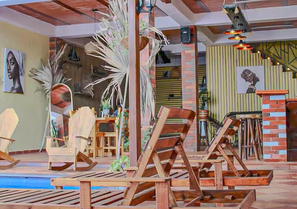 a group of chairs sitting in a room at Amano Property in Santa Marta