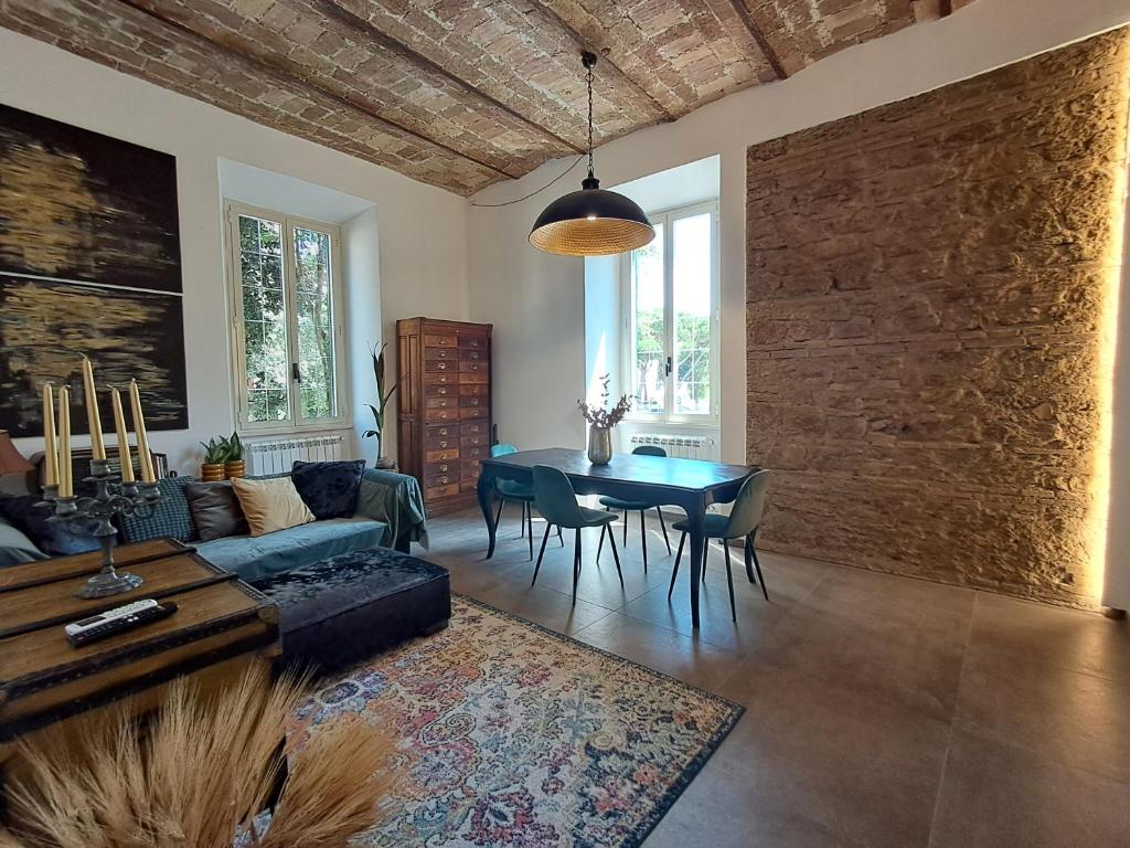 a living room with a couch and a table at MATA Home in Civitavecchia